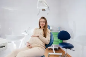 woman pregnant sitting in exam chair in Vancouver